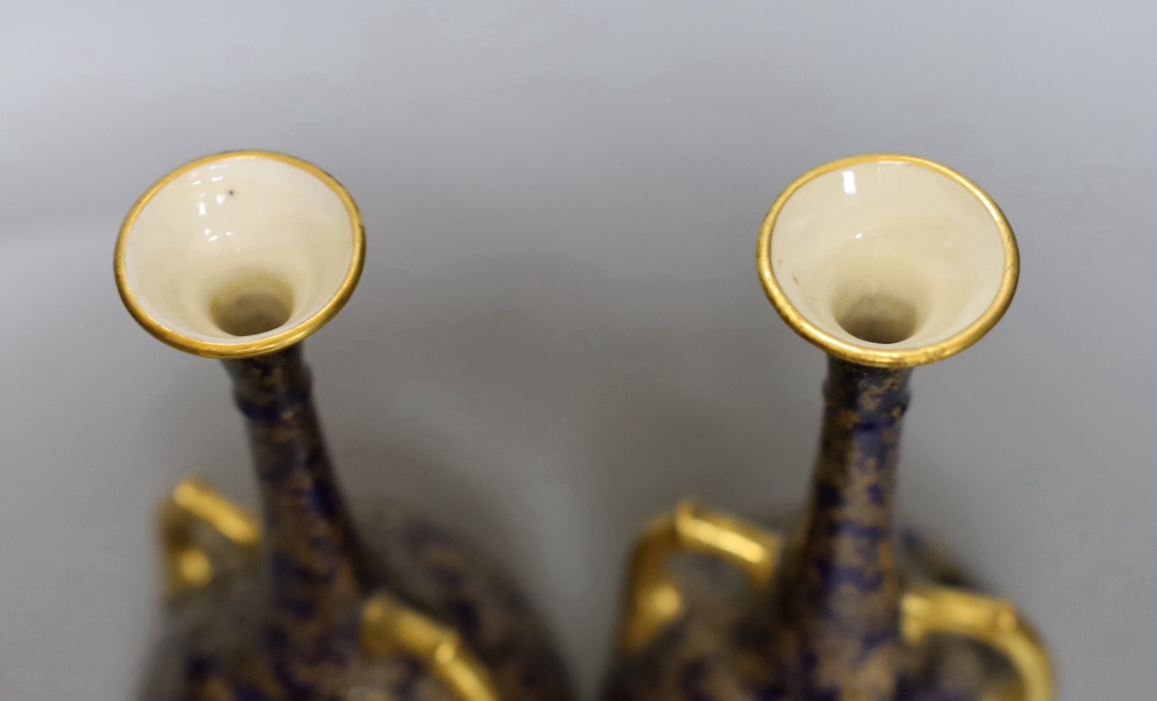 A pair of Royal Worcester bottle vases and a Coalport landscape vignette vase and cover, pair of vases 20 cms high